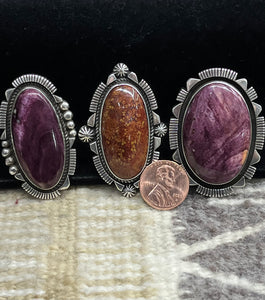 Purple spiny and dinosaur bone rings