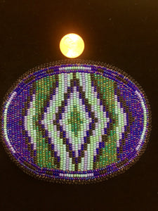 Beaded belt buckles